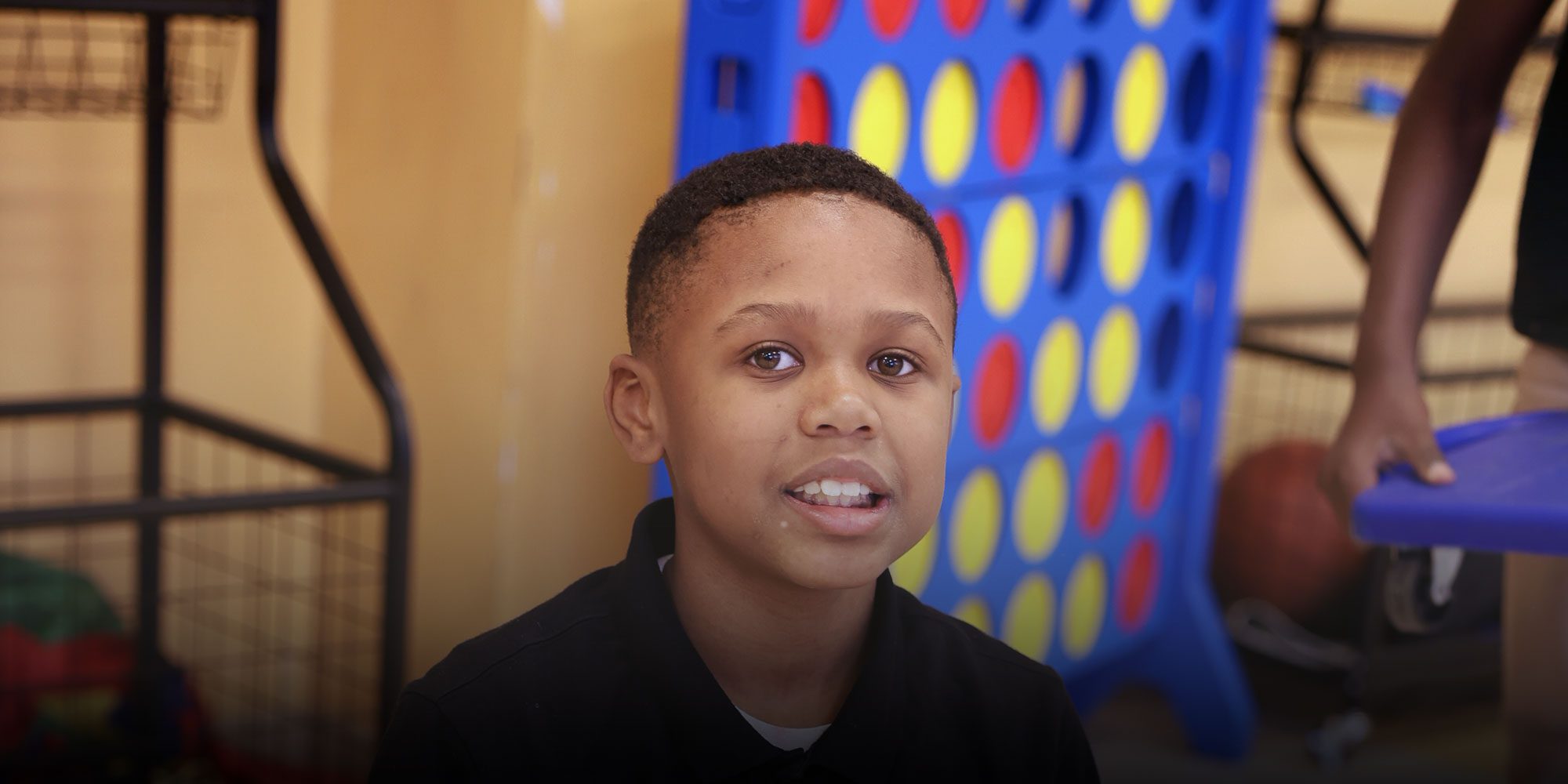 Student sitting on floor